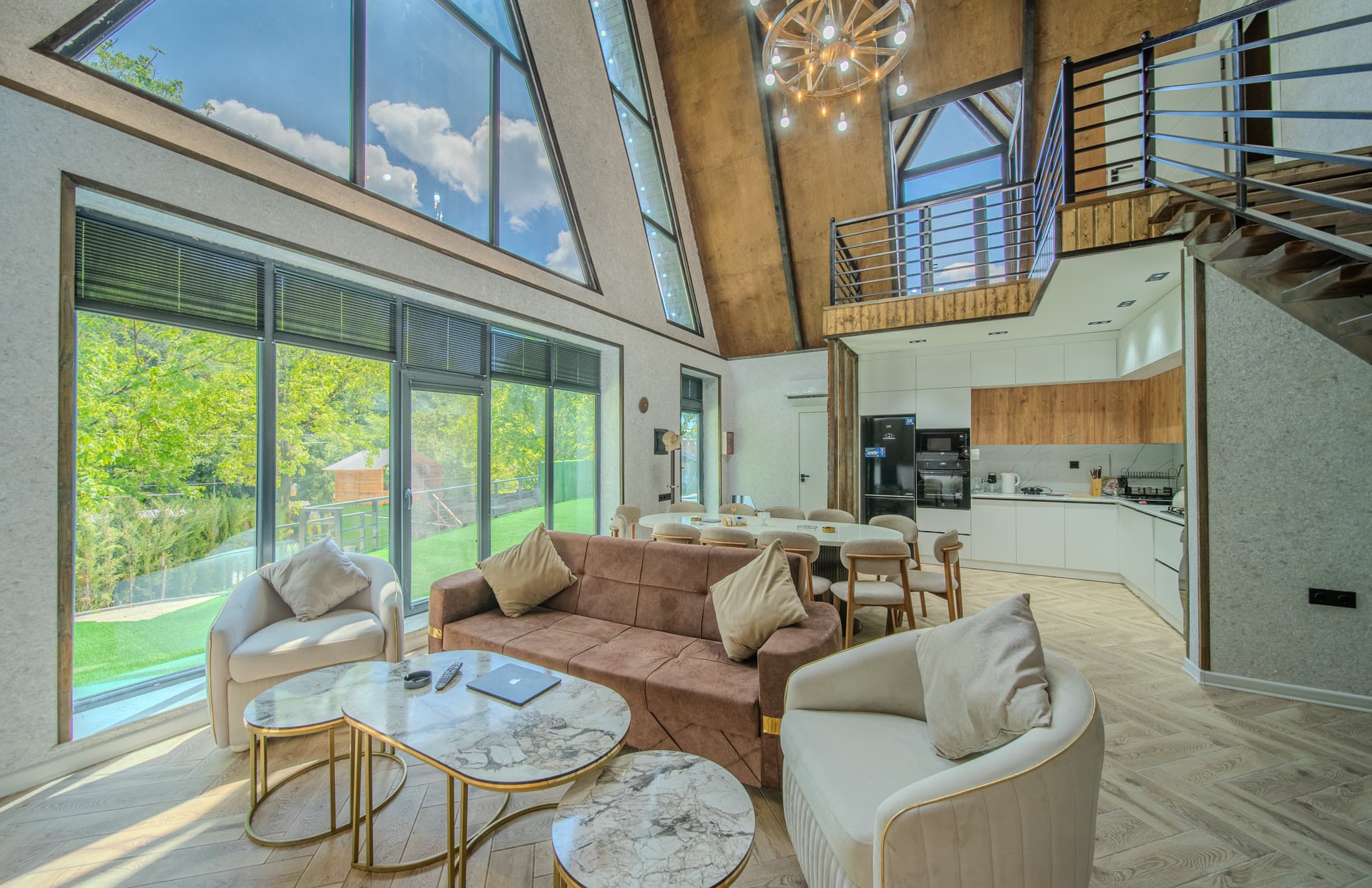 Cathedral A-frame living room with floor-to-ceiling glass