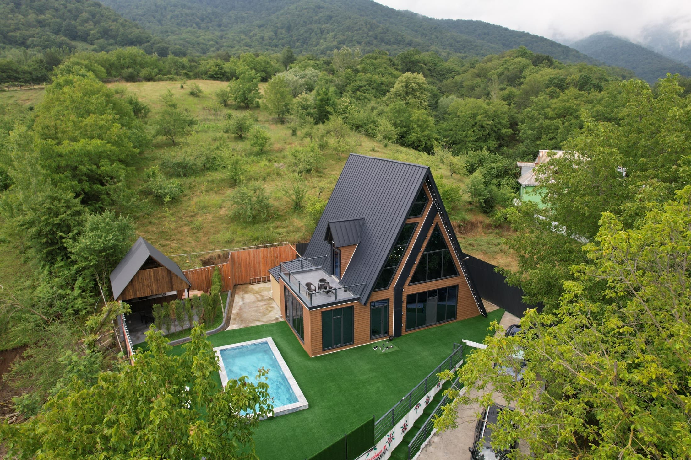 A-Frame house with pool, aerial